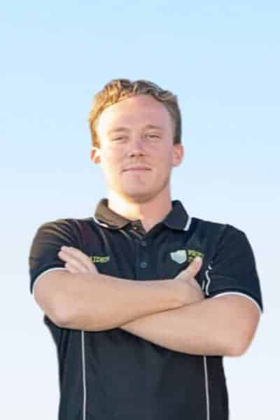 Photo of Aiden Wallace, Proven Energy team member Aiden Wallace standing with arms crossed